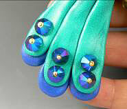 Clay peacock tail feathers with glass beads
